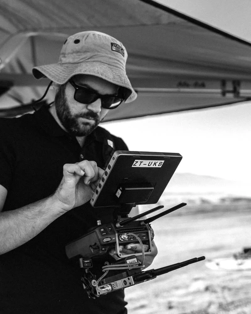 Dimitri Vaindirlis on location, working a drone controller in the field